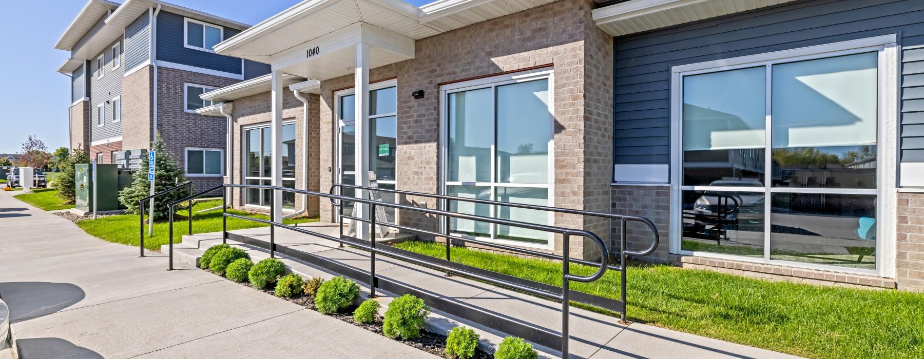 a building with a fence in front