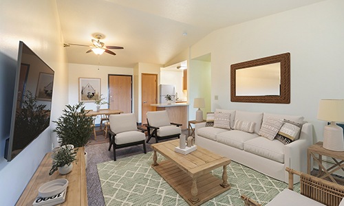 living room with coffee table and mirror on the wall