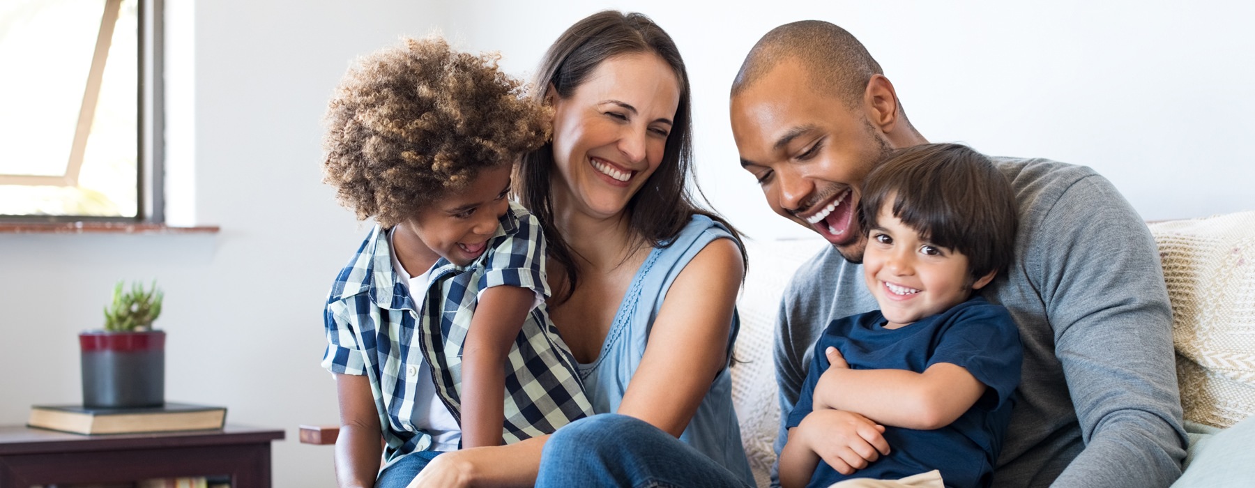 man woman and kids laughing