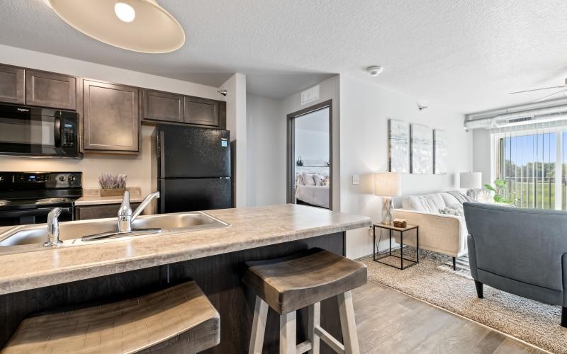 a kitchen with a bar stool
